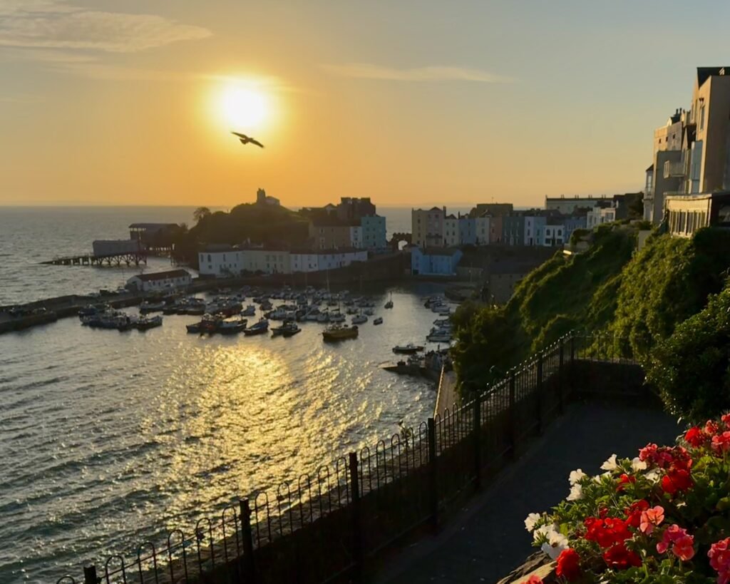Sun rising above Castle Hill in Tenby, Pembrokeshire, Wales