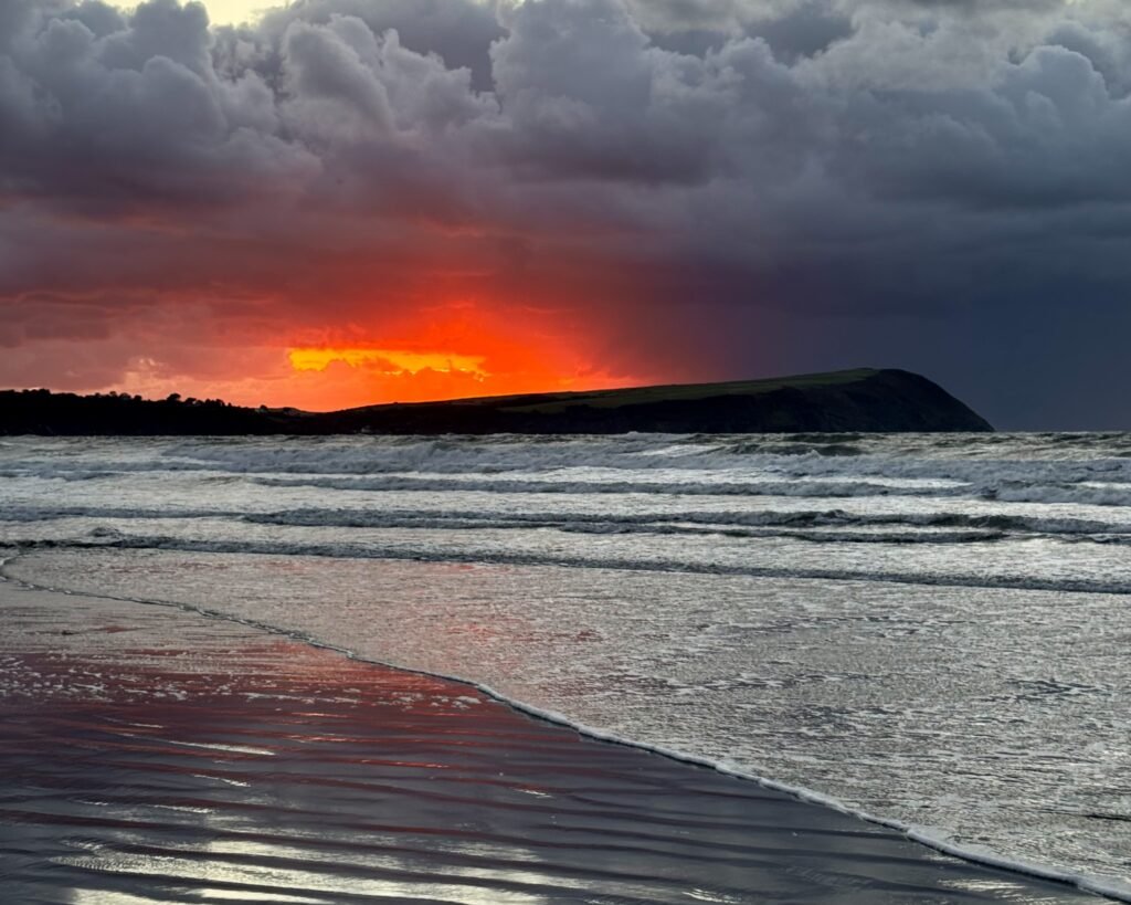 Dramatic sunset sky over Dinas Head, Pembrokeshire, Wales