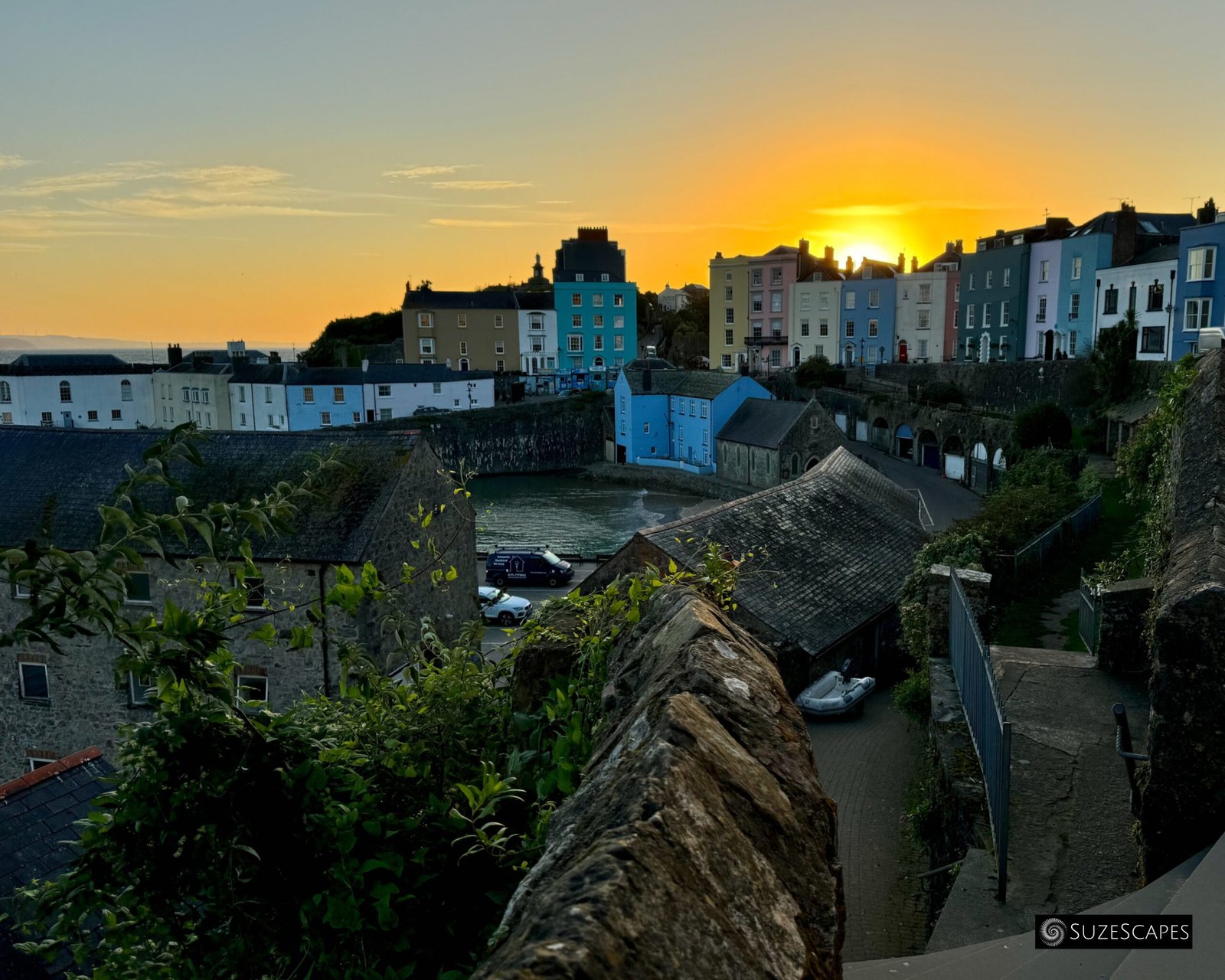 Sun rising above Tenby, Pembrokeshire, Wales