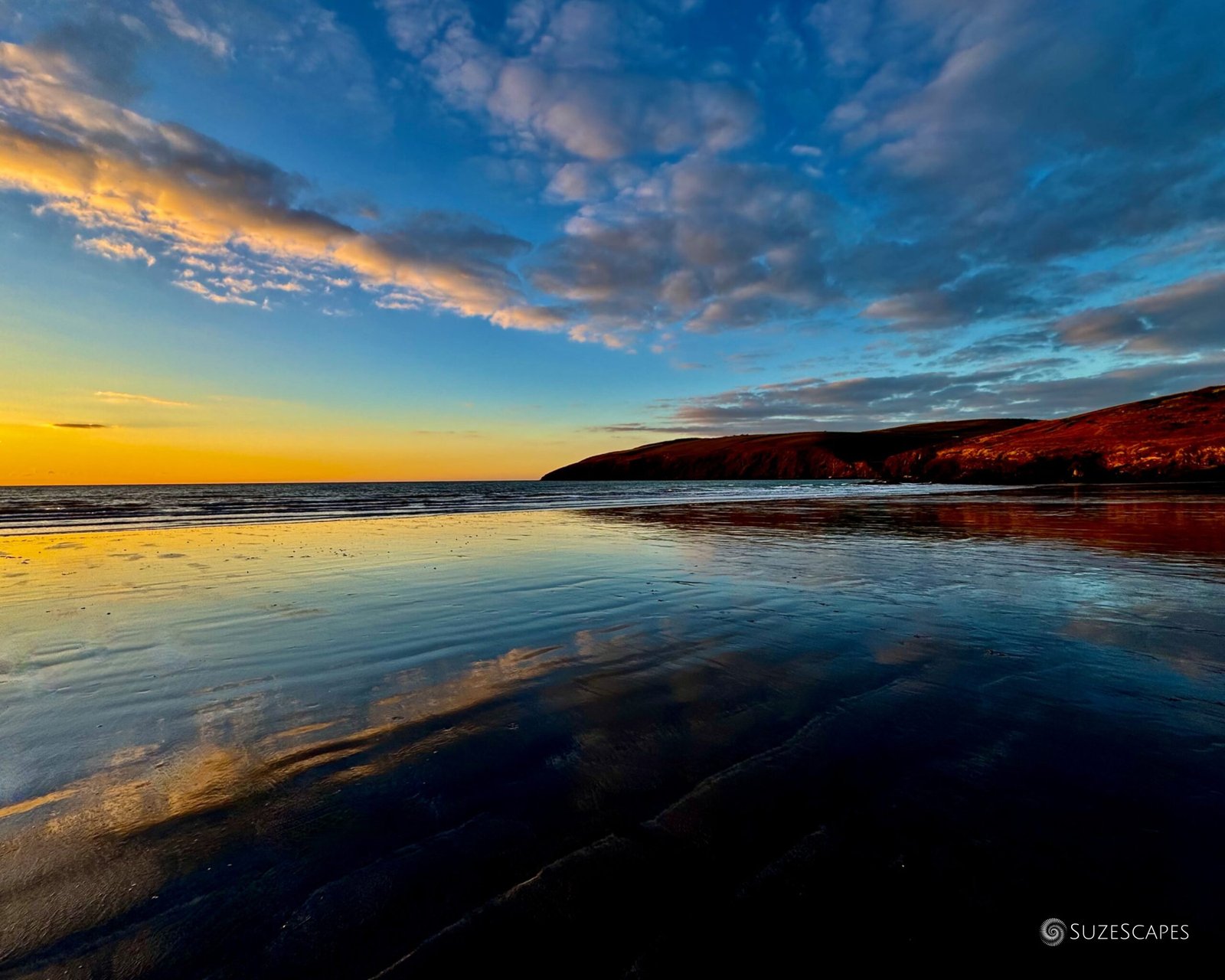 Sundown reflections at Newport Sands, Pembrokeshire, Wales